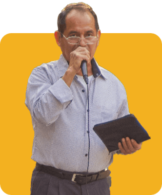 Latin Man Speaking with a mic holding a Bible